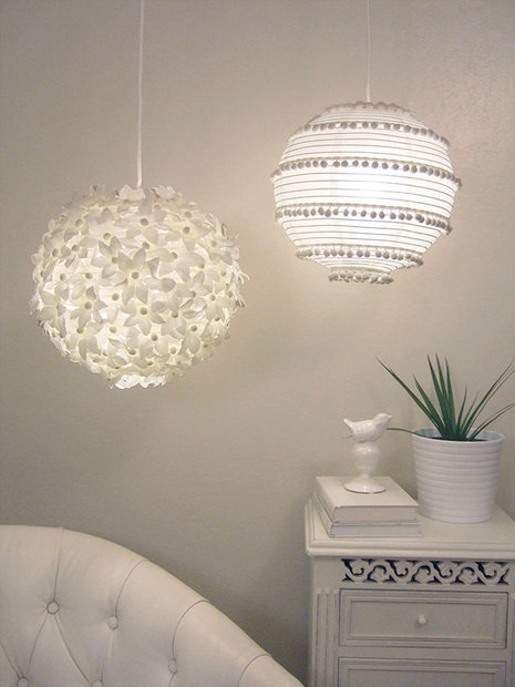 Two, white, decorative hanging globe lamps.