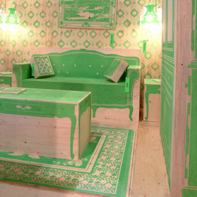 A living room in tan and green.