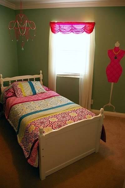 A young girl's room with bight pastel bedding.