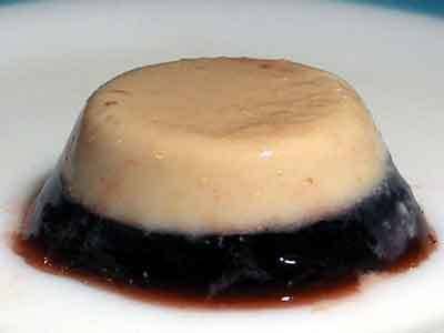 A upside down gelatin cake with a tan top and a dark red bottom.