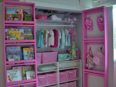 A very pink girls walk in closet.