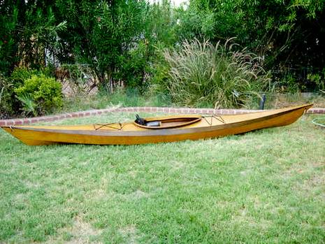 Wooden kayak building in the garden.