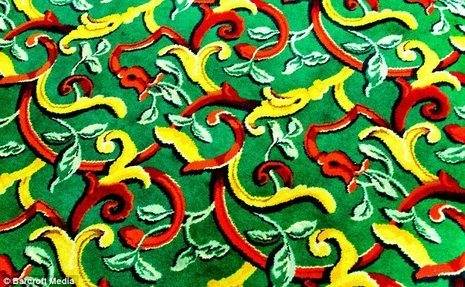 A vibrant colored carpet with a red, yellow, and green pattern.