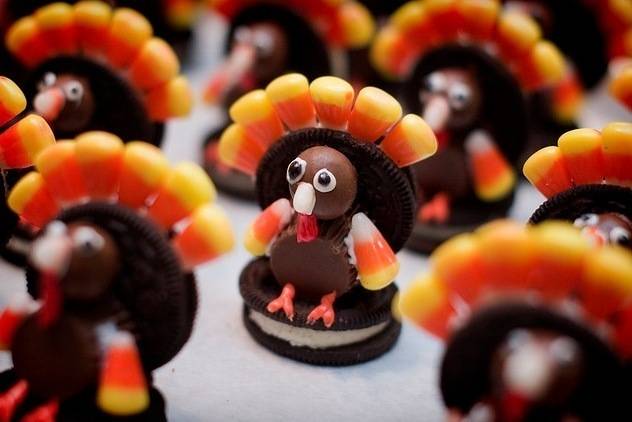 Oreo cookies decorated with chocolates and candycorn to make a turkey figurine.