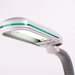 A green and white overhead natural sunlight lamp.