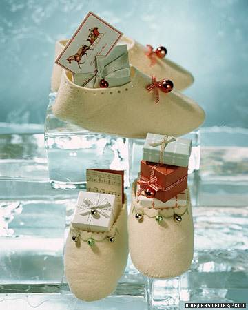 Beige color slippers stuffed with gifts and shown from different angles.