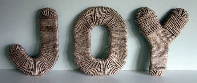 It displays the letters JOY which made from jute.