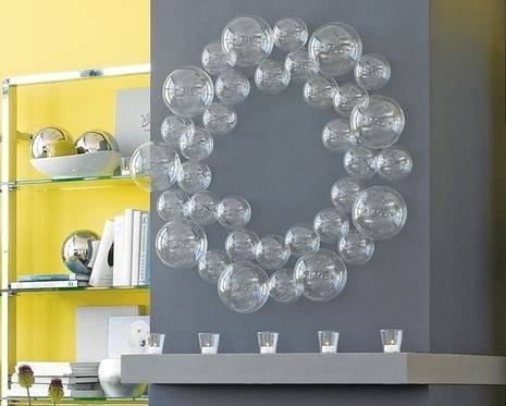 A circular wreath made up of varying sizes of glass globes.
