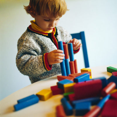 "Kid using Building Blocks for Creativity"
