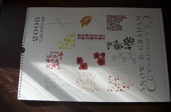 A 2008 calendar page with pictures of flowers.