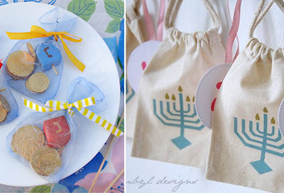 A couple Hanukkah sacks next to a plate of cookies.
