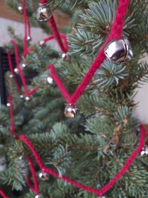 A garland with red string and bells.
