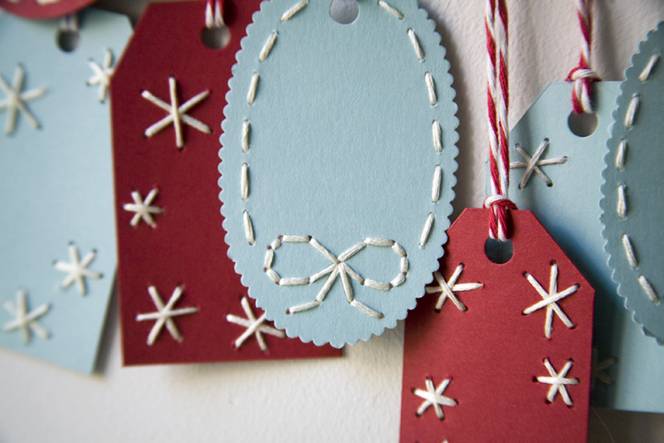 Assorted homemade gift tags in red and blue.