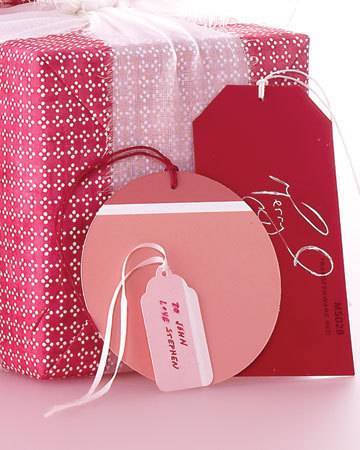 Pink color gift box with tags.