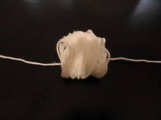 White color yarn to make pom pom flower.