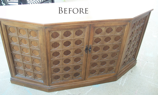 Vintage wooden cabinet with 4 doors and before is written above it.