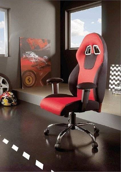 A red and black computer chair is in a gray room.