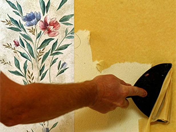 A section of floral wallpaper next to a person removing yellow wallpaper with a scraper.