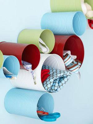 Blue, green, white and red tubes hold knickknacks and various items