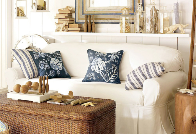 Pottery barn with cushion and cabinet table.