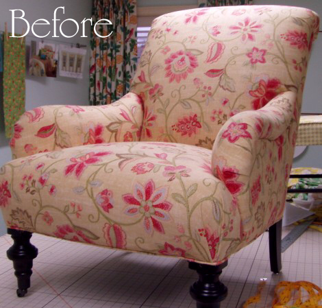 Floral reupholster chair with designer wooden legs.