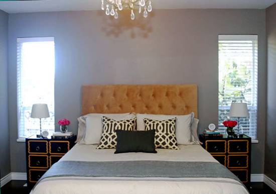 A cute bedroom design featureing a queen bed.