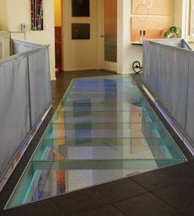 A glass flooring brings attractive and bright vibes to your house.