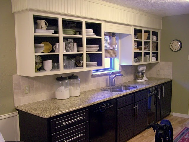 A newly finished kitchen counter with shelves.