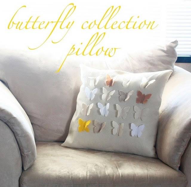 Butterfly felt pillow on sofa.