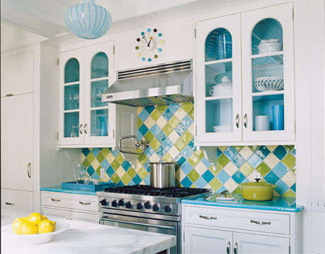 " A  turquoise wall tiled and wartrobed  kitchen "