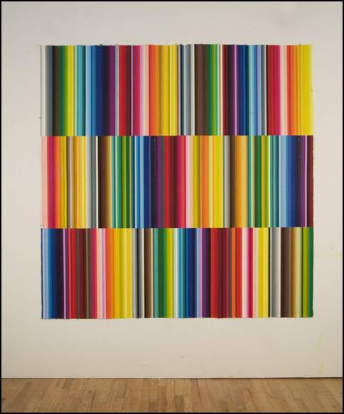 Colorful striped art on wall.