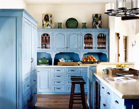 Blue color turquoise kitchen with cupboards.