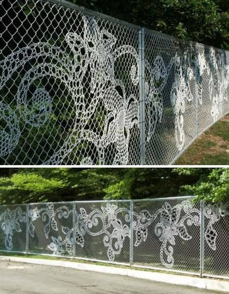 Metal gates have decorative artwork on them.