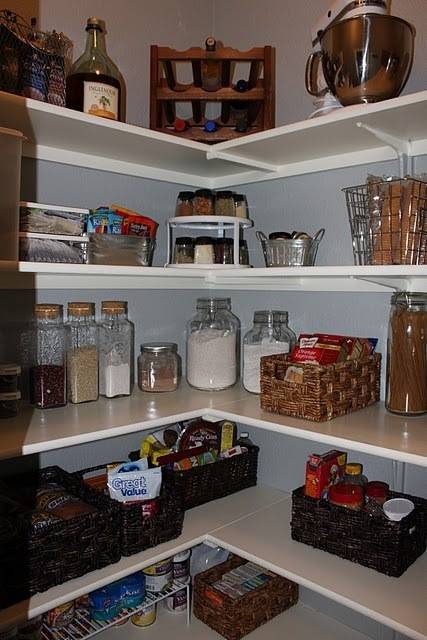 Pantry items in corner rack shelves.