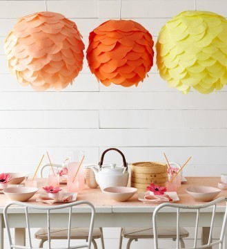 Colorful laterns hanging above the dining table.
