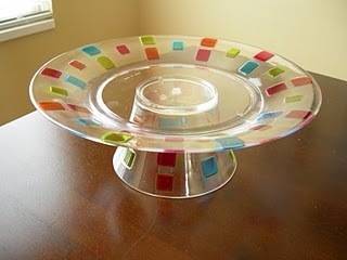 " A  glass made cake stand in  table"