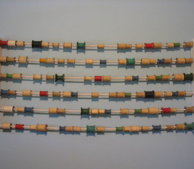 Art abacus using spools of thread
