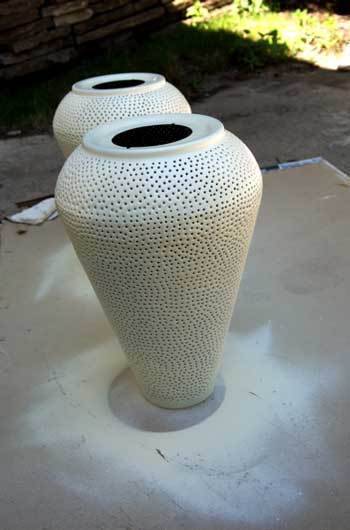 Flower pots sprayed with white color.