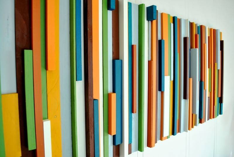 Colorful wood arts hanging on the wall.