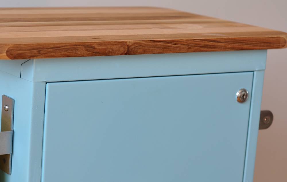 Place your cutting board on top of the cabinet, and mark where the screws will need to go to secure it.