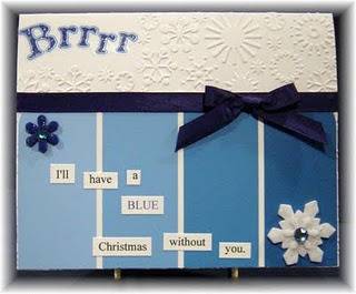A blue and white Christmas card that has been homemade.