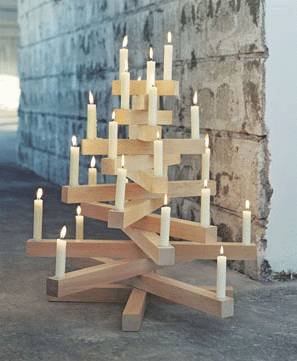 A wooden tree with candles light.