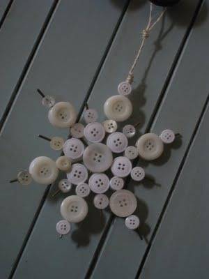 A star shaped ornament made by joining buttons.