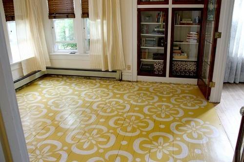 A cabinet door opening to a room with a yellow and white patterned floor.