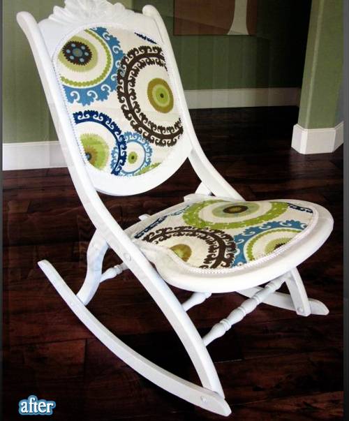 A white rocker with a colorful patterned seat.