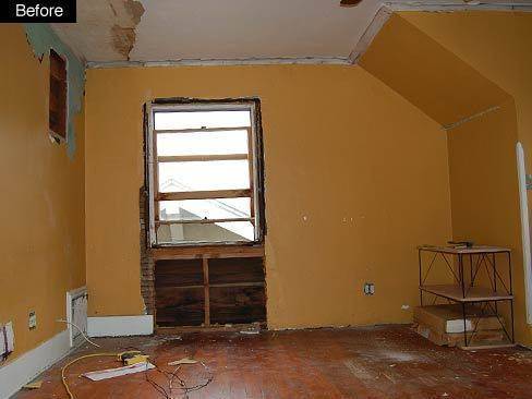 A room under construction with tattered walls.