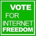 A vote for internet freedom sign on a green background.