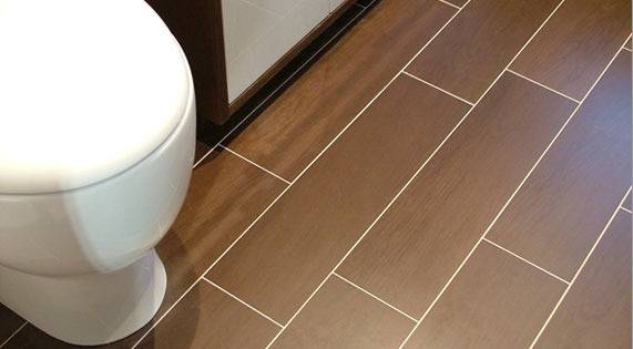 Rectangle shaped wood tiles in bathroom.