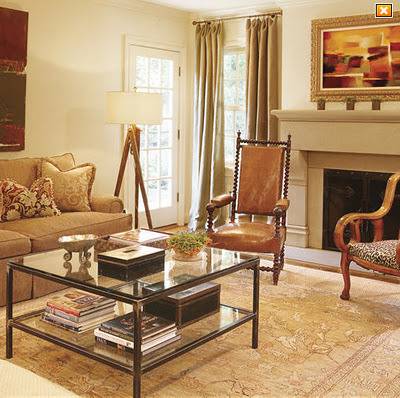 A living room contains seating, a large coffee table, and a fireplace.
