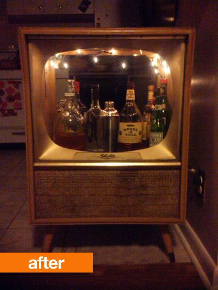 A variety of wines has been set up in a hollowed out console television.